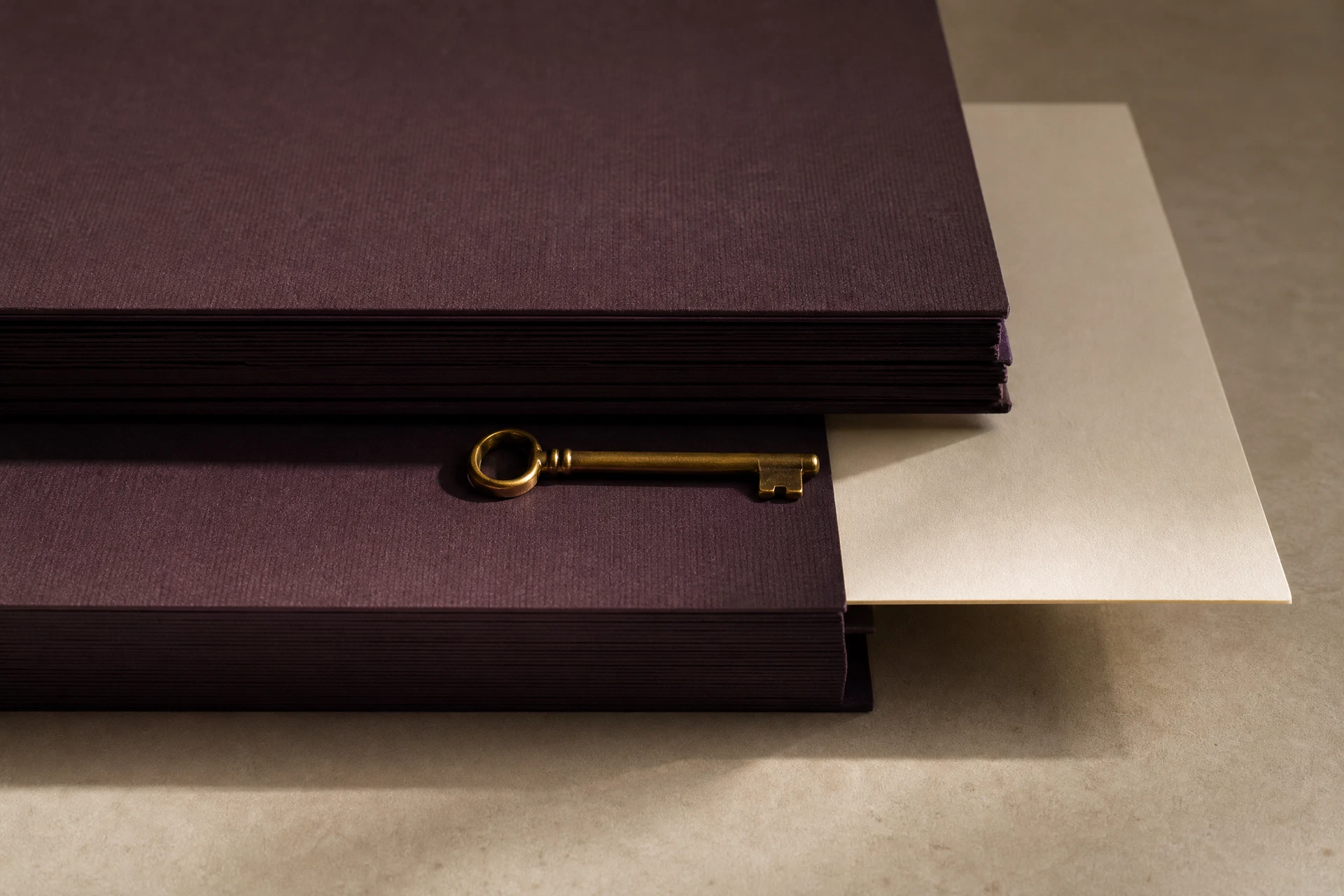 Plum folders, an antique-gold key, and an ivory card suggesting clearer business boundaries